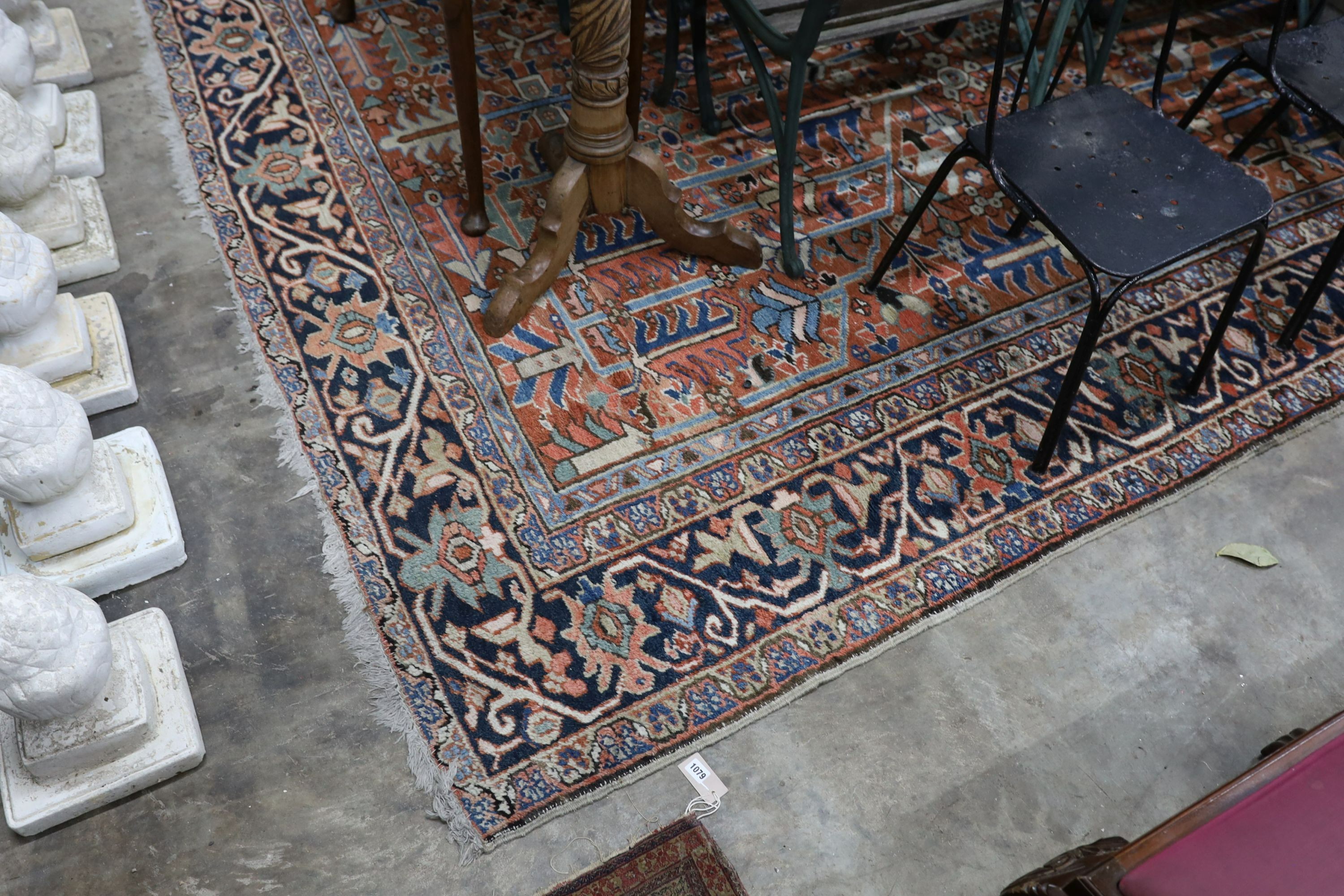 A Caucasian red ground carpet, 390 x 285cm